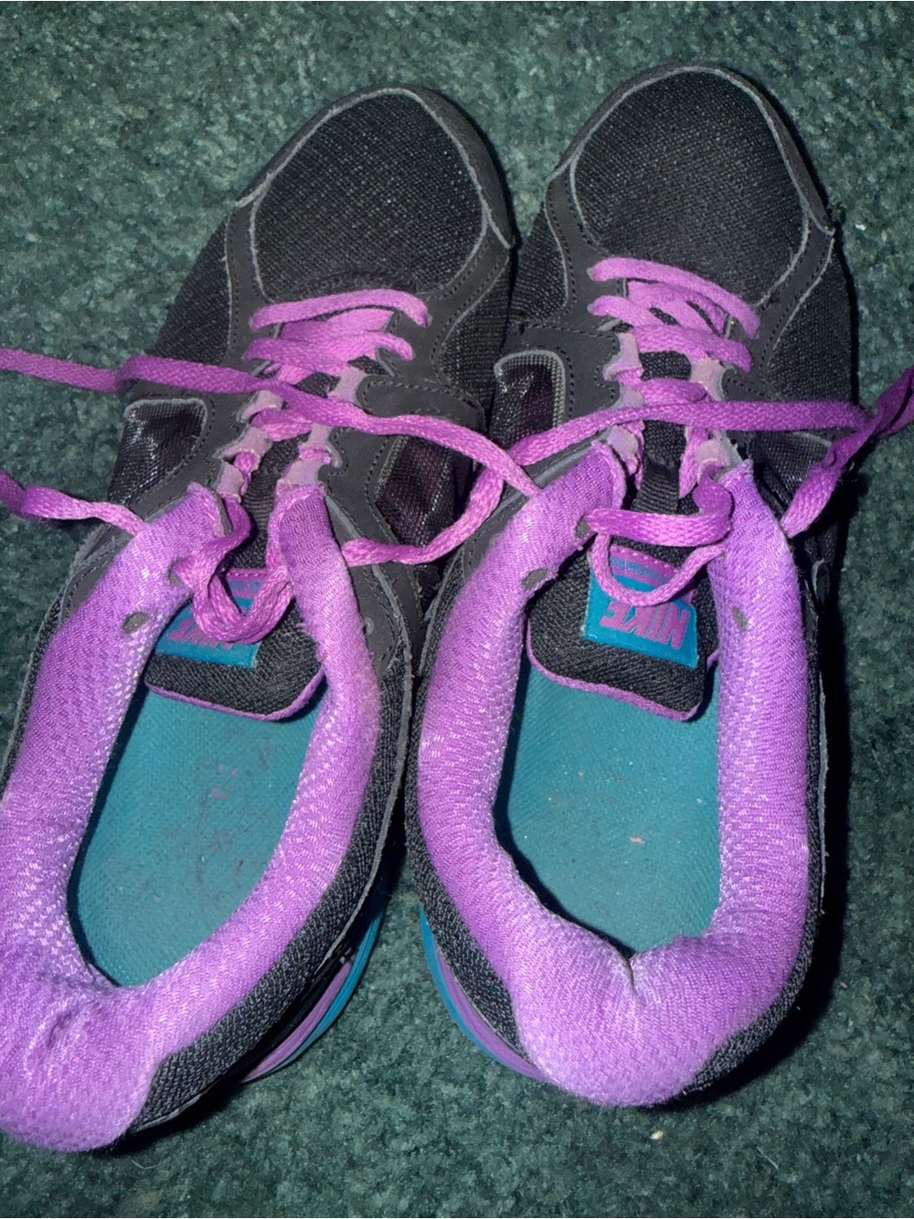 Nike Women’s Black Sneakers with Purple Lining